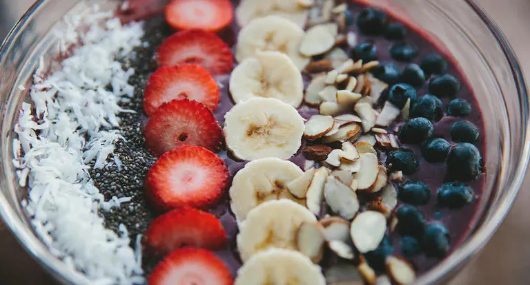 Vibrant acai rainbow bowl with fresh fruits and granola
