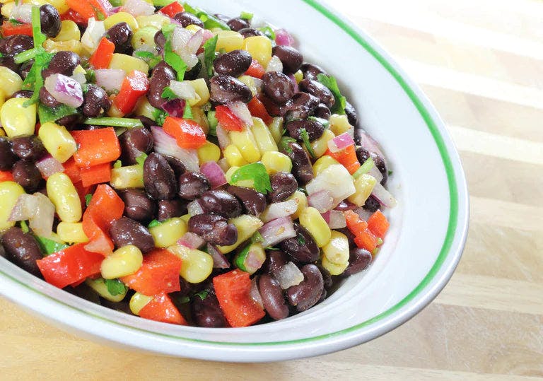 Fresh black bean and corn salad with colorful vegetables