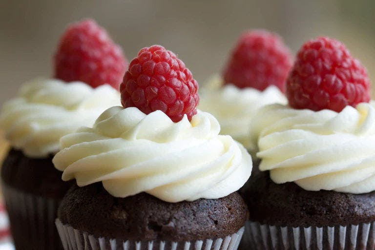 Decadent chocolate cupcakes with zesty lemon raspberry frosting