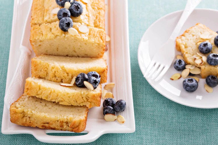 Slices of poundcake garnished with blueberries and almonds