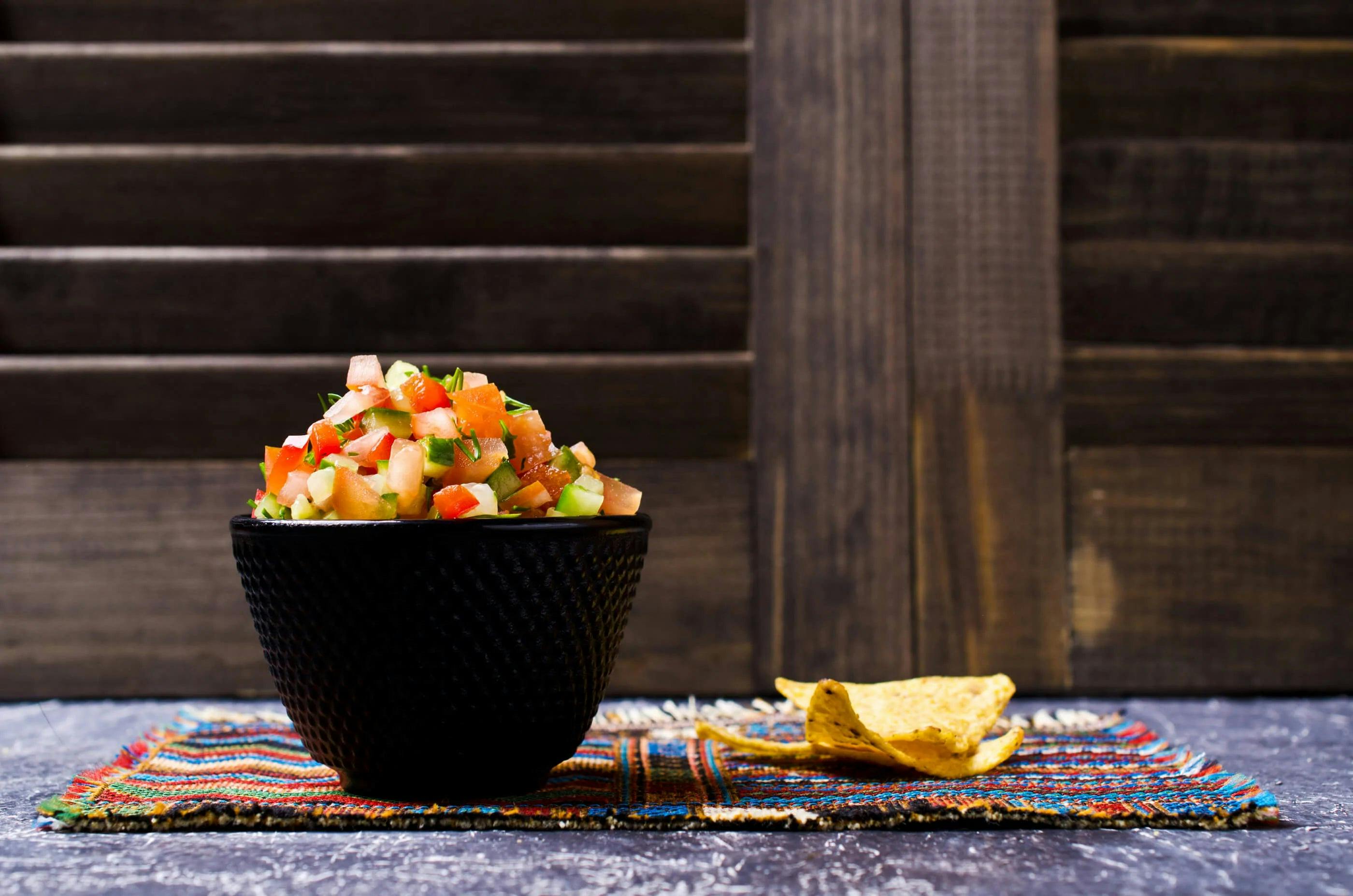 Vibrant orange garden salsa in a bowl