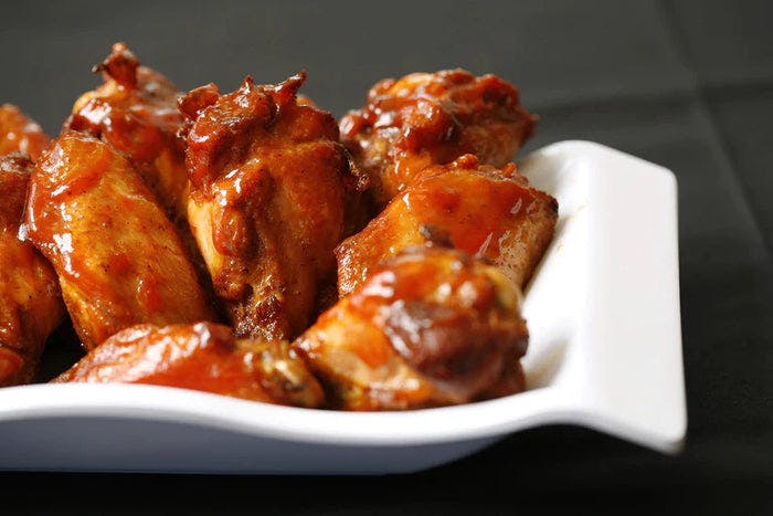 Grilled True Lemon Pepper BBQ Wings on a plate