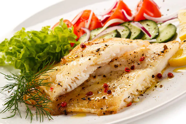 Delicious Moroccan spiced cod dish with a side of roasted vegetables