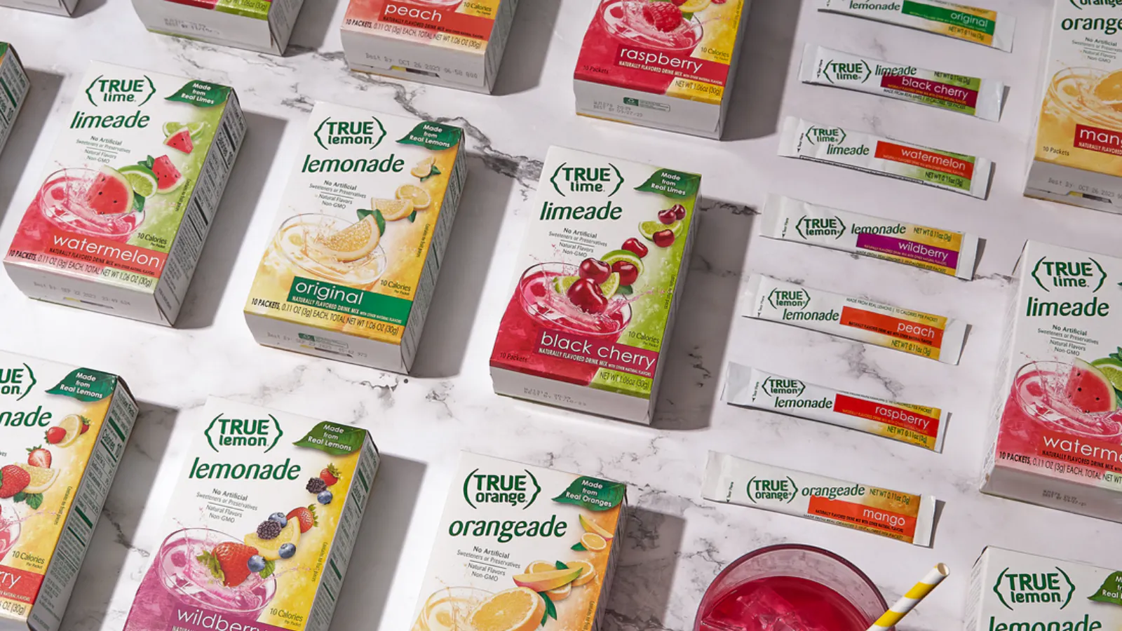An array of True Citrus products arranged on a kitchen counter.