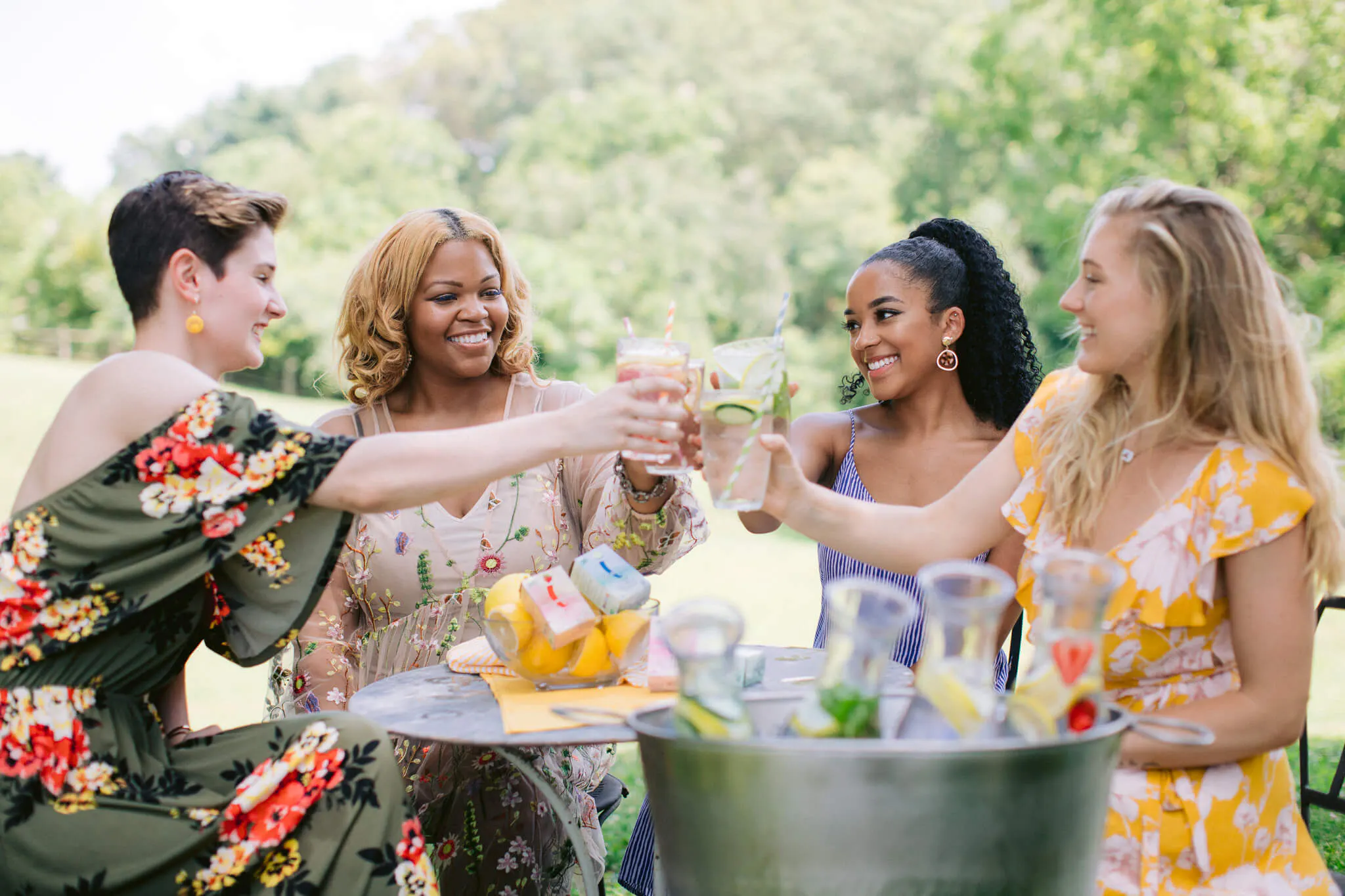 women at the park enjoying drinks