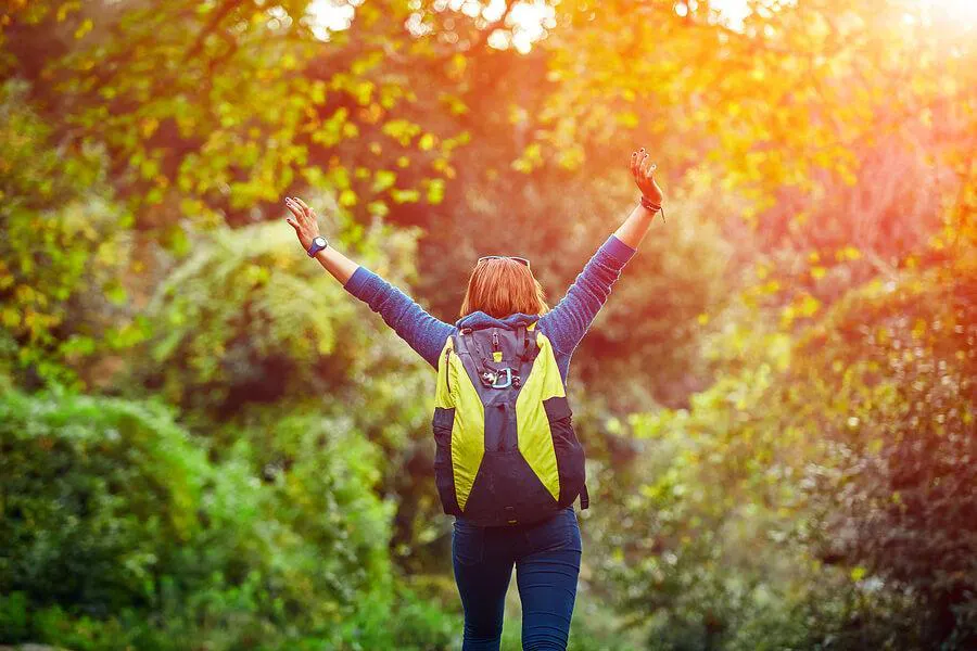 women stretches while hiking