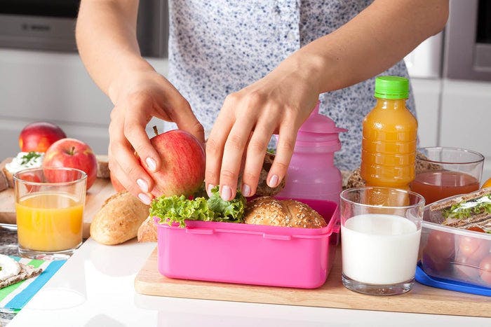 woman packing a healthy lunch