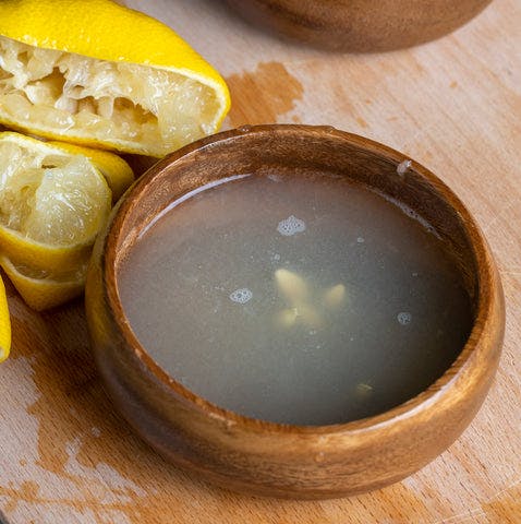 Expired lemon juice in a bowl